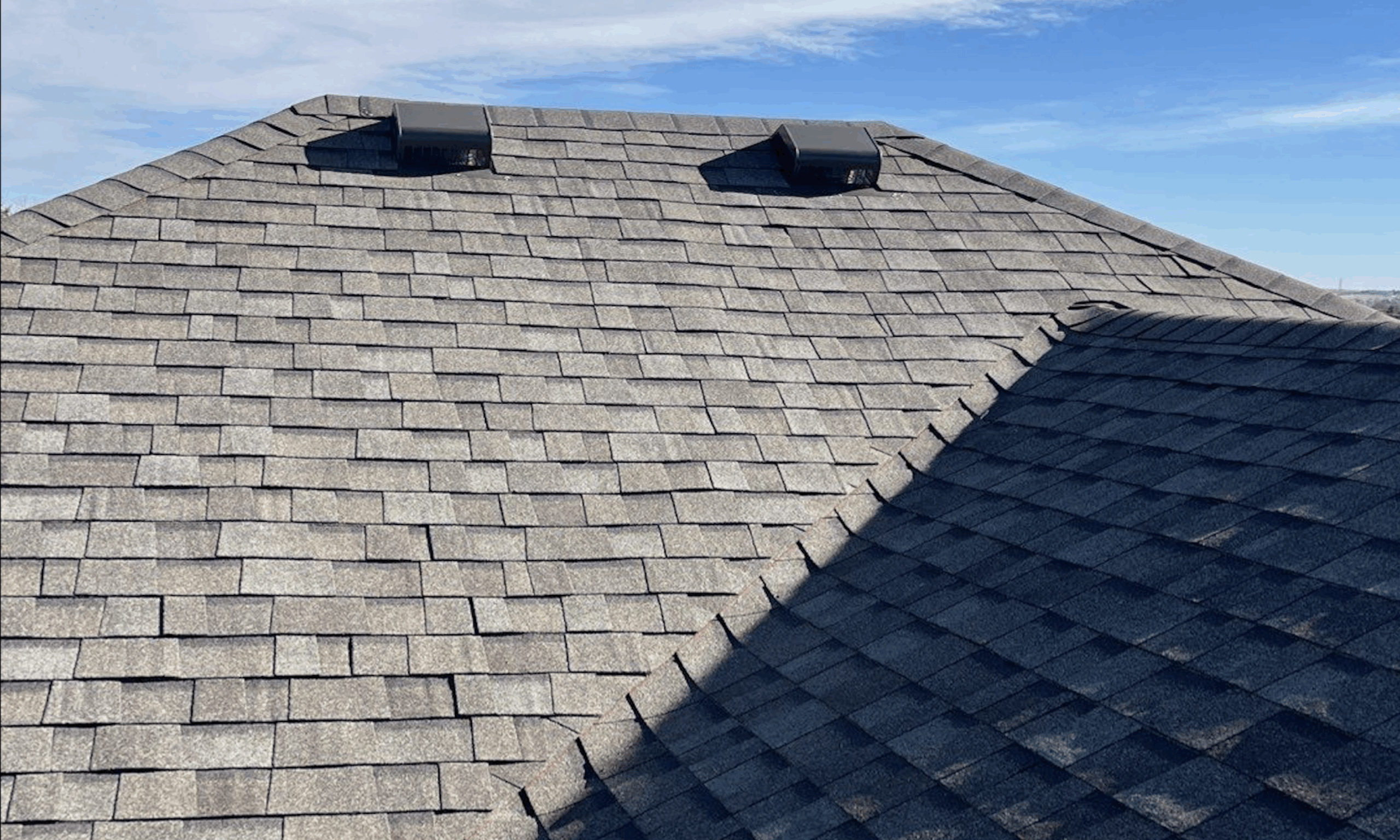 Side view of an expansive shingled roof