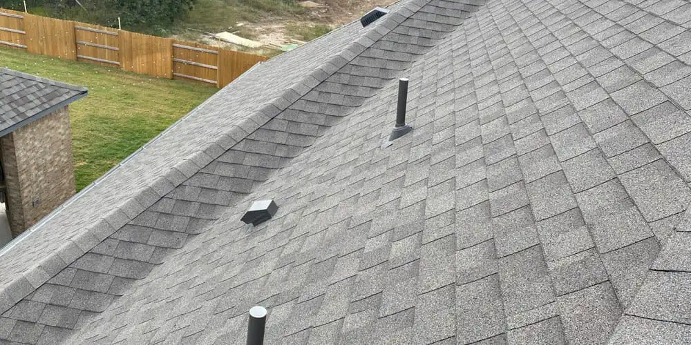 Clean installation of new shingles during an asphalt roof replacement in Westminster, CO.