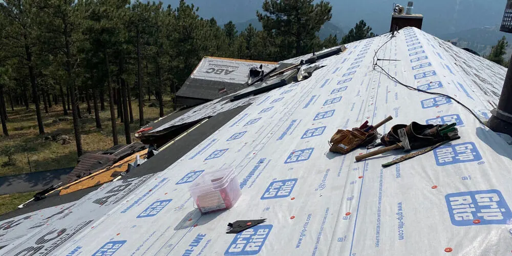 Hail and wind storm damage roof inspection by Mile High Roofing Contractor in Longmont, CO